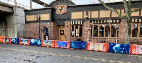 Art on the barriers at Black Horse Tavern