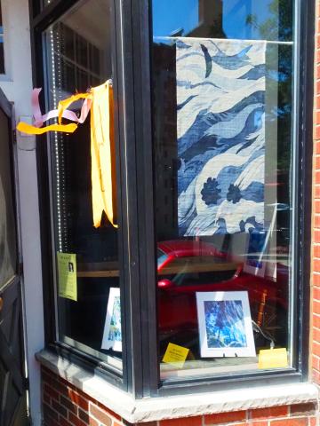 Art in August artworks in shop window