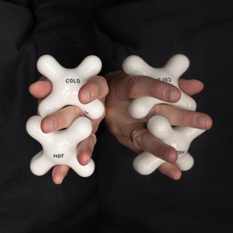 Hands entwined with knobs