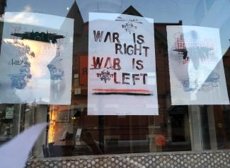War is Right-War is Left: posters displayed in window