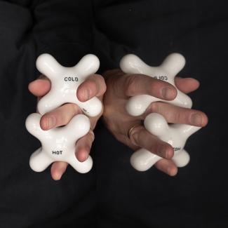 Hands entwined with knobs