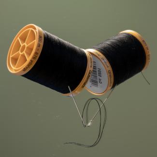 Two spools of thread